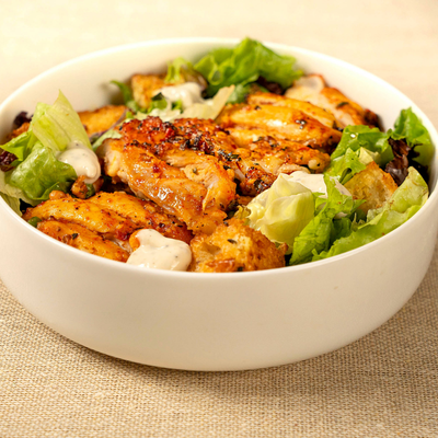 Caesar Salad Topped with Pan Seared Chicken & Garlicky Croutons